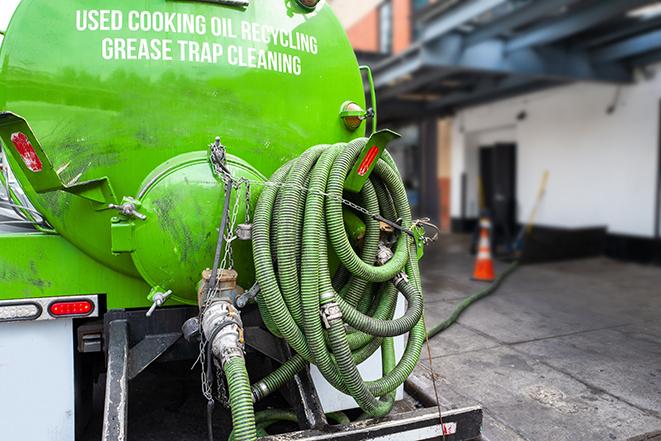 a pump truck emptying a grease trap in Bowling Green, OH